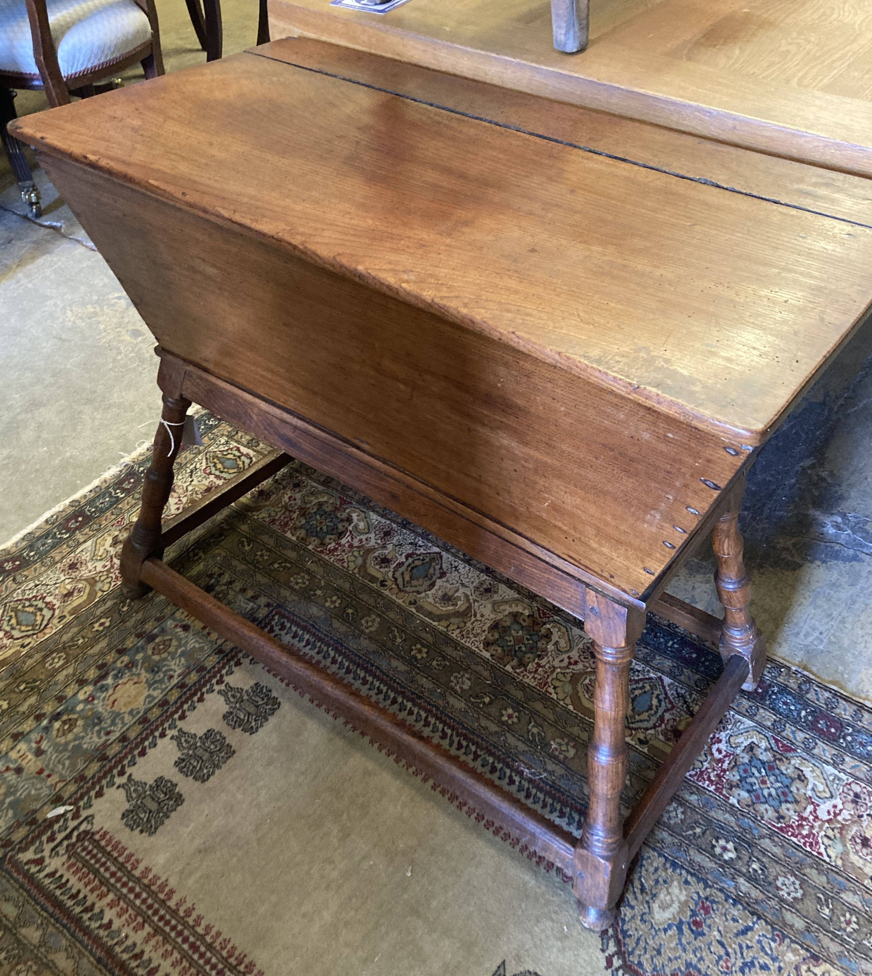 An 18th century elm and fruitwood dough bin, length 90cm, depth 47cm, height 76cm